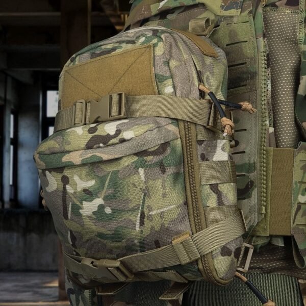 Hiker wearing a modular assault pack mounted on a tactical vest