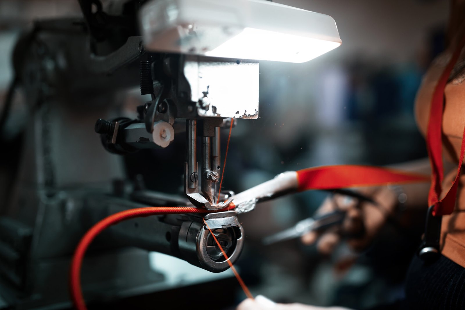 Precision stitching process in PANOAR tactical gear manufacturing factory.