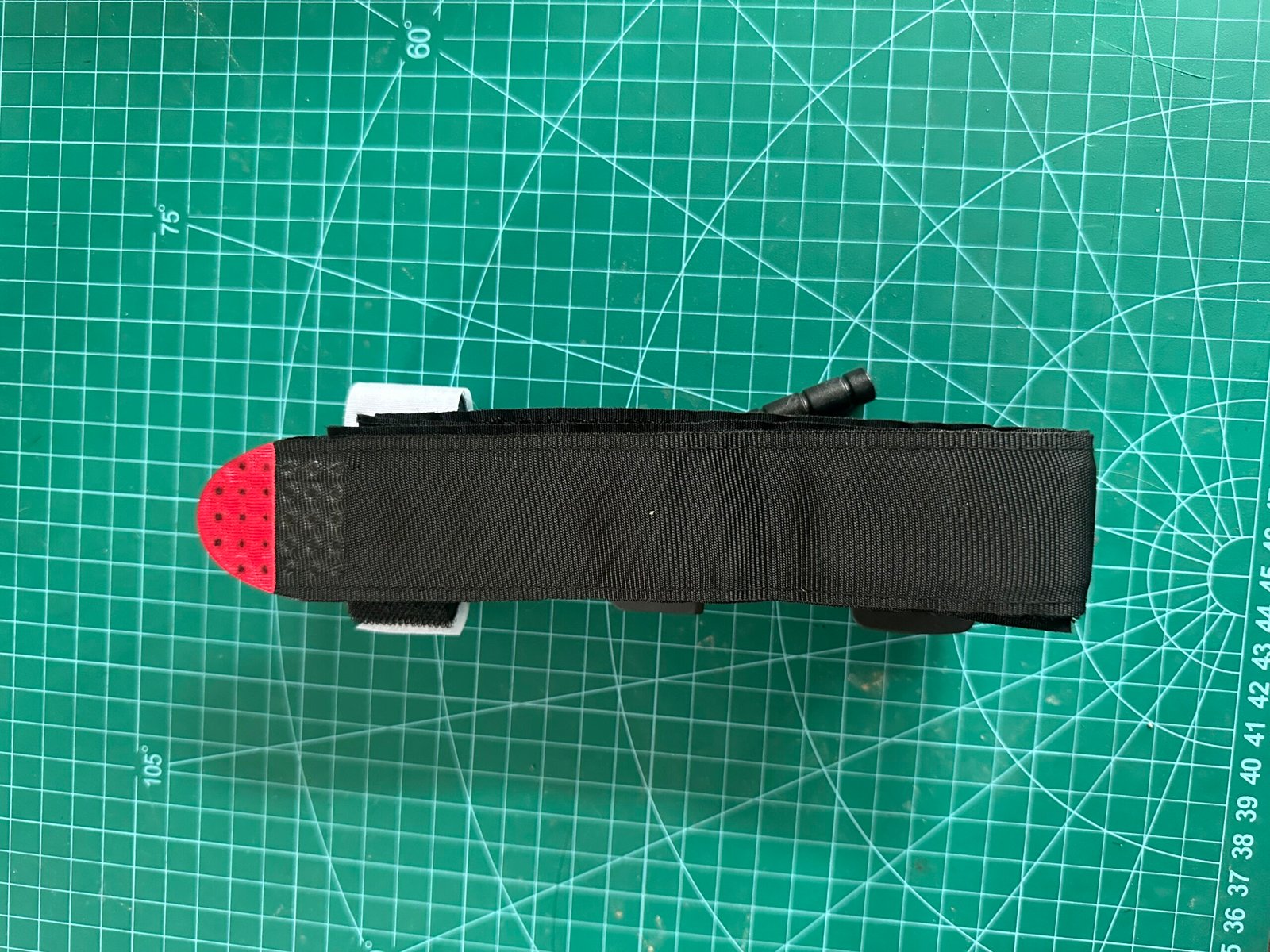 Custom MOLLE pouch detail with webbing and pull tab design