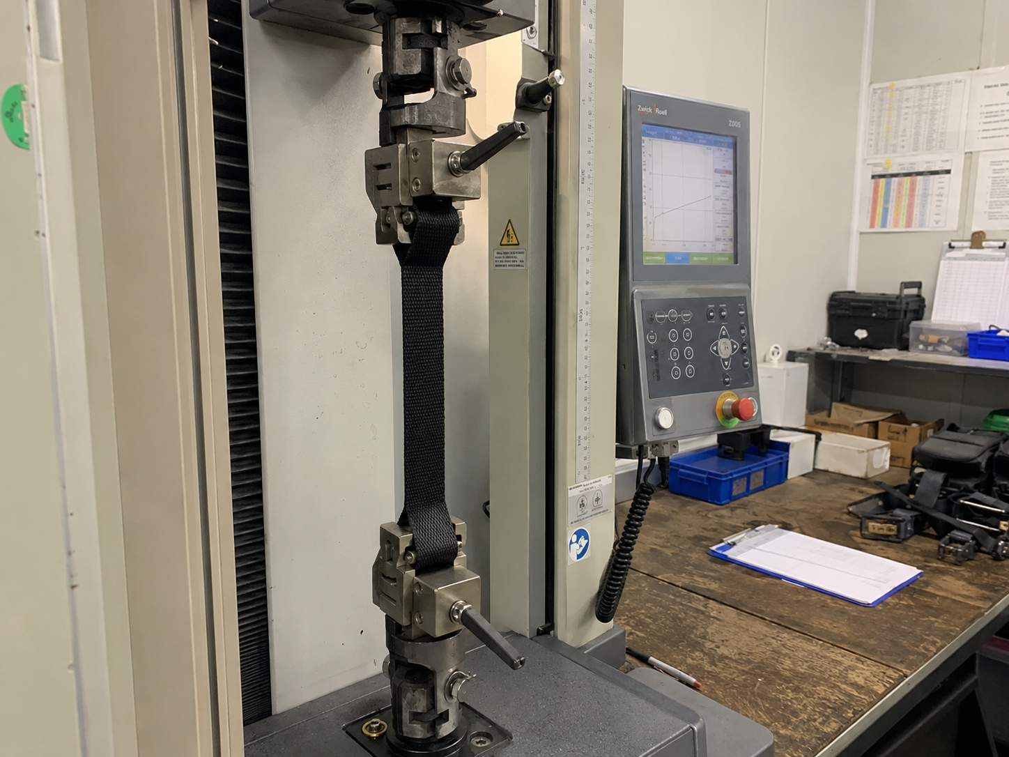 Webbing specimen positioned in a tensile testing machine