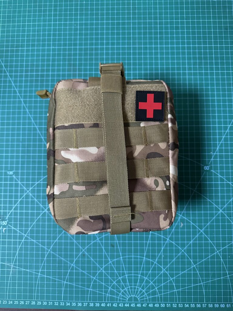 Testing MOLLE pouch compatibility during tactical gear production