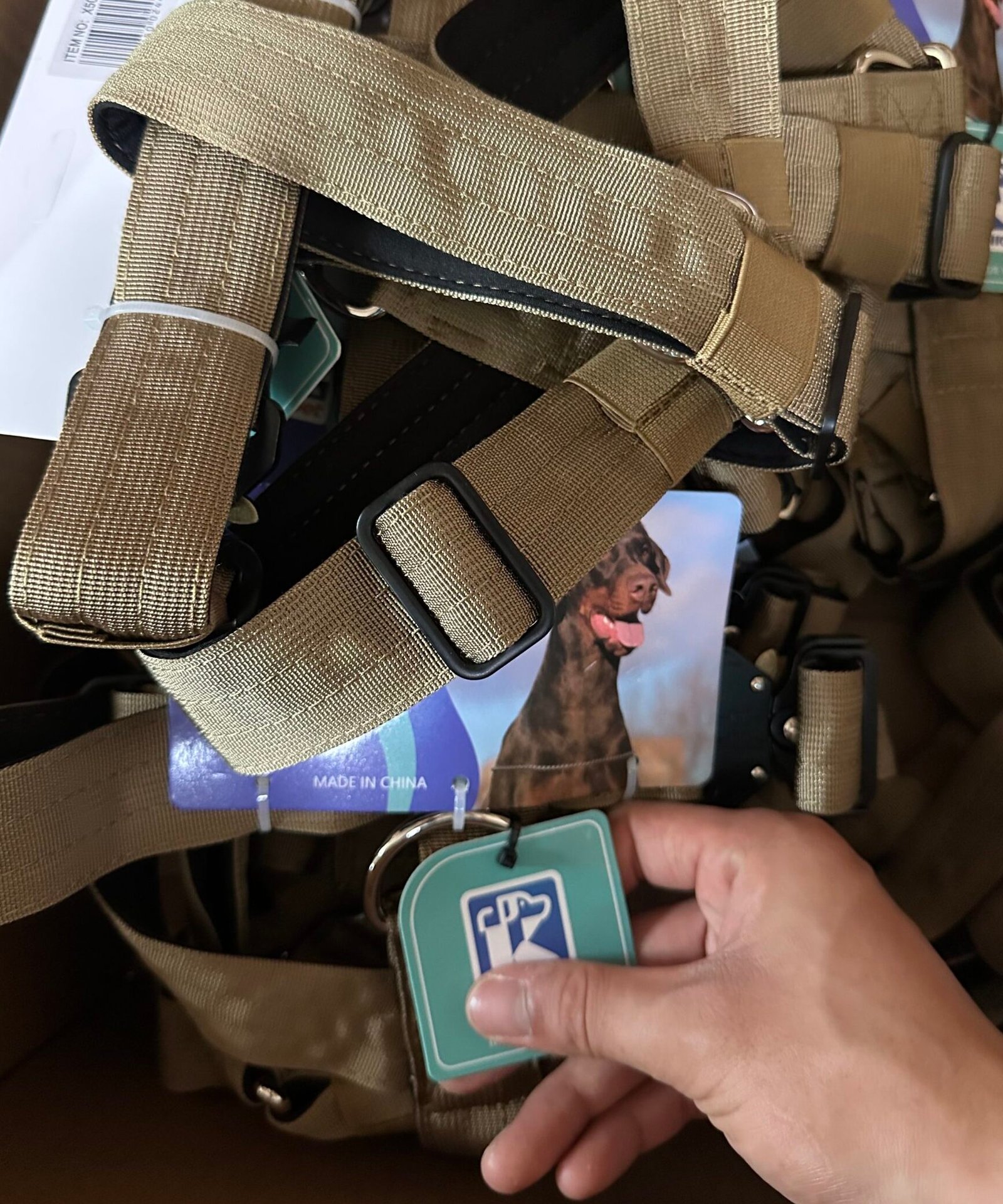 Private label K9 tactical harness hang tag and webbing detail for branded dog gear