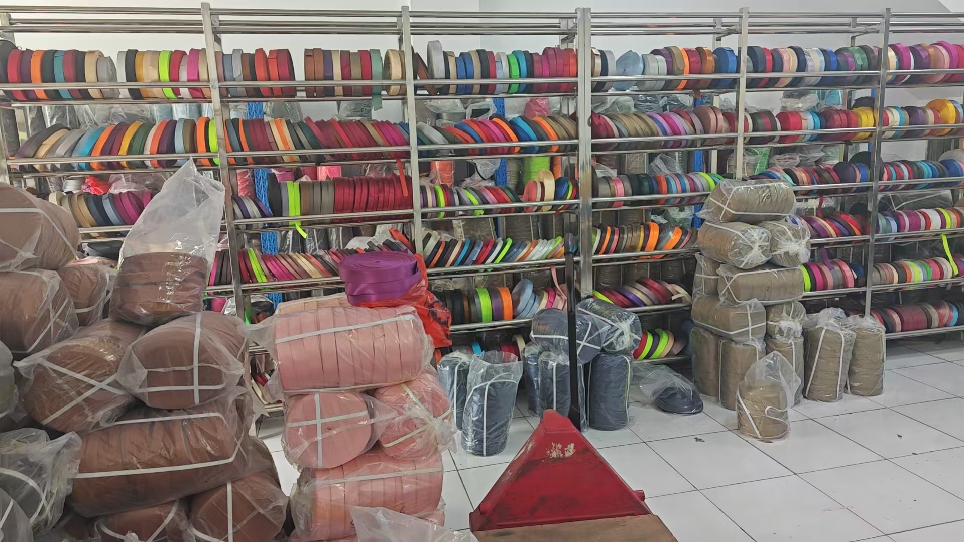 Racks of colored webbing rolls