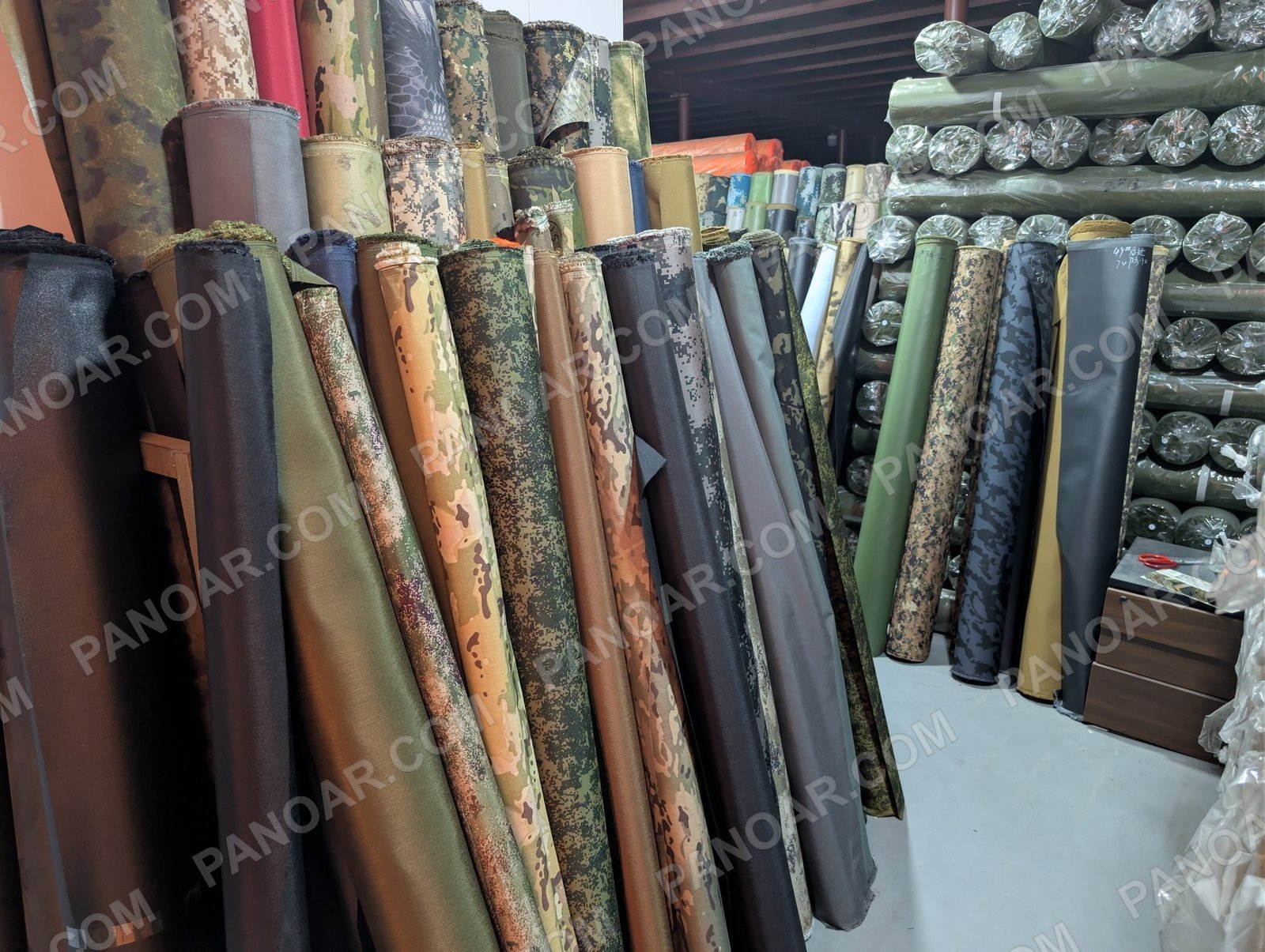 Camouflage fabric rolls displayed together