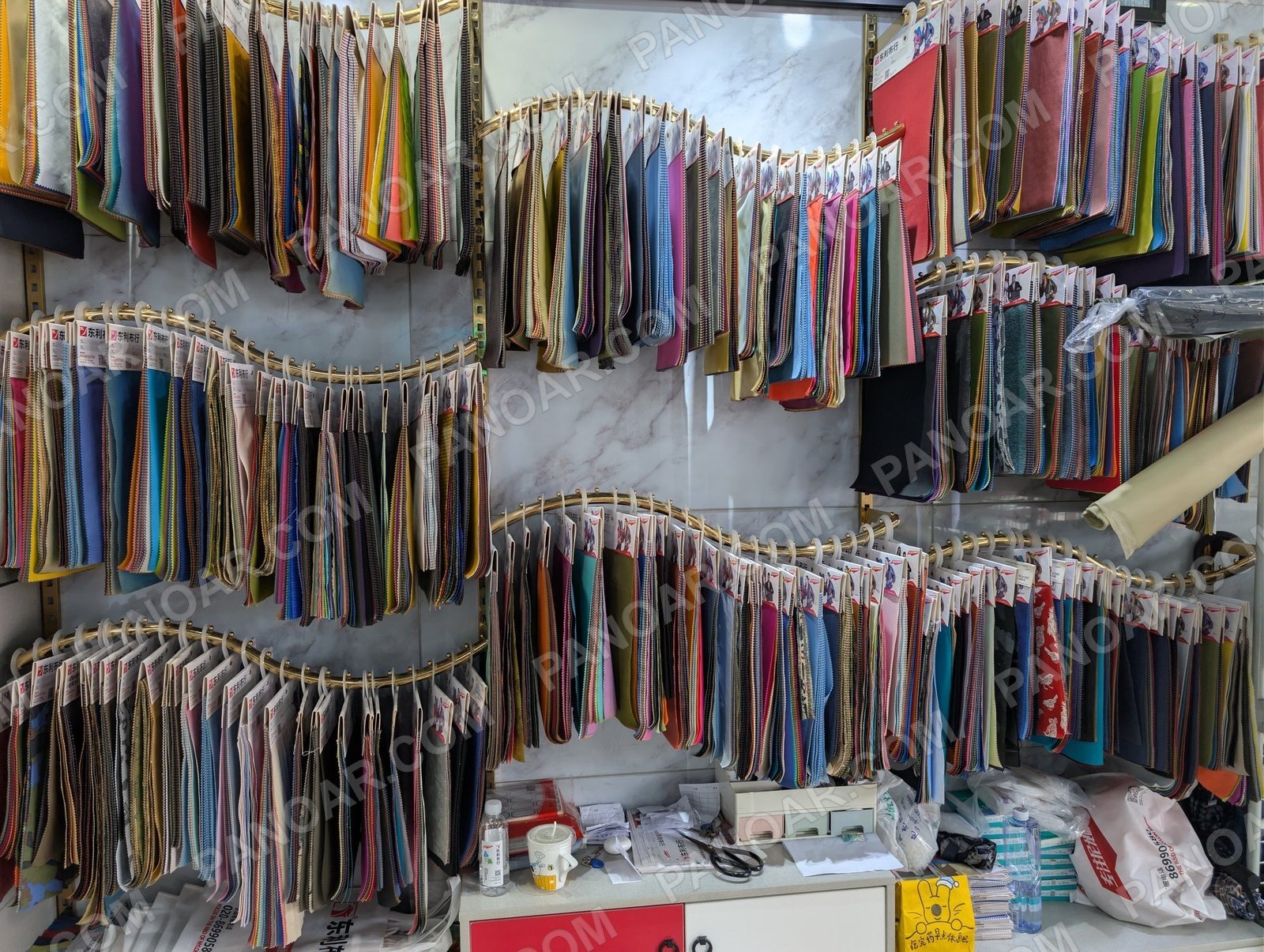 Hanging fabric swatches on display