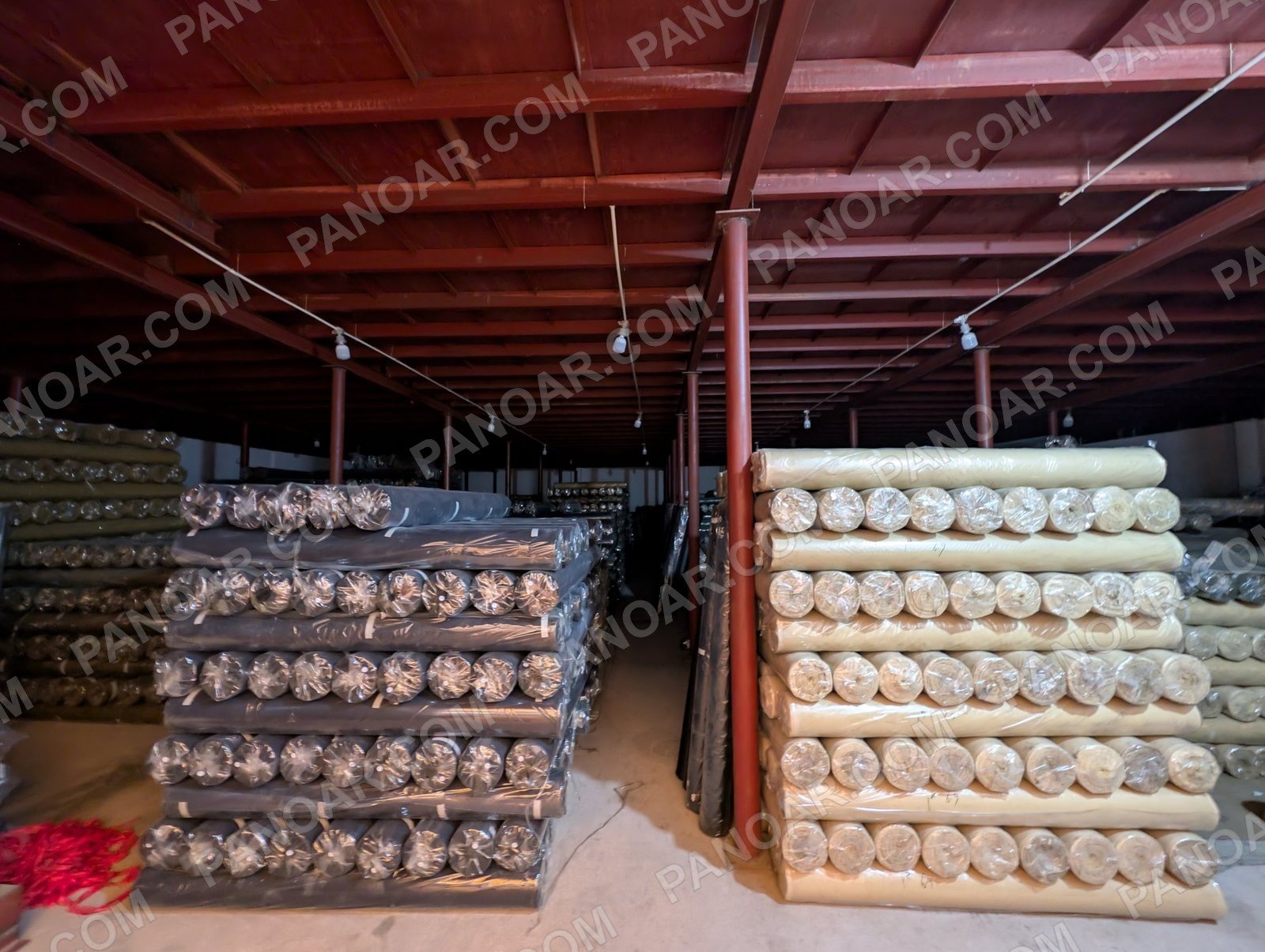 Light and dark fabric rolls on shelves