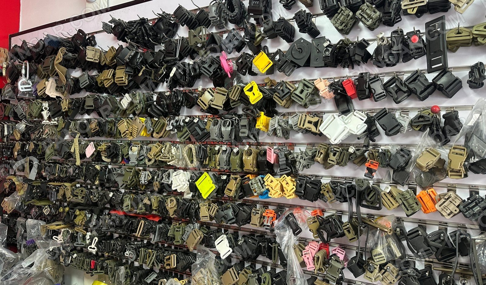 Wall of buckles, clips and connecting hardware