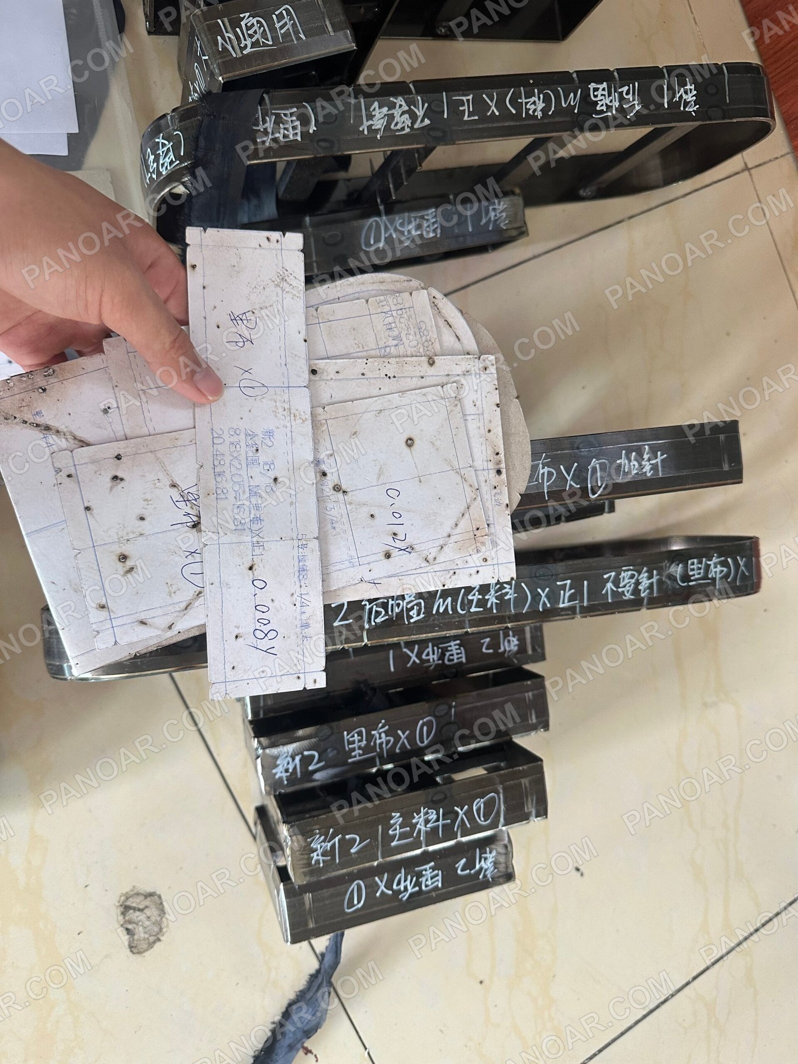 Paper patterns beside metal cutting dies