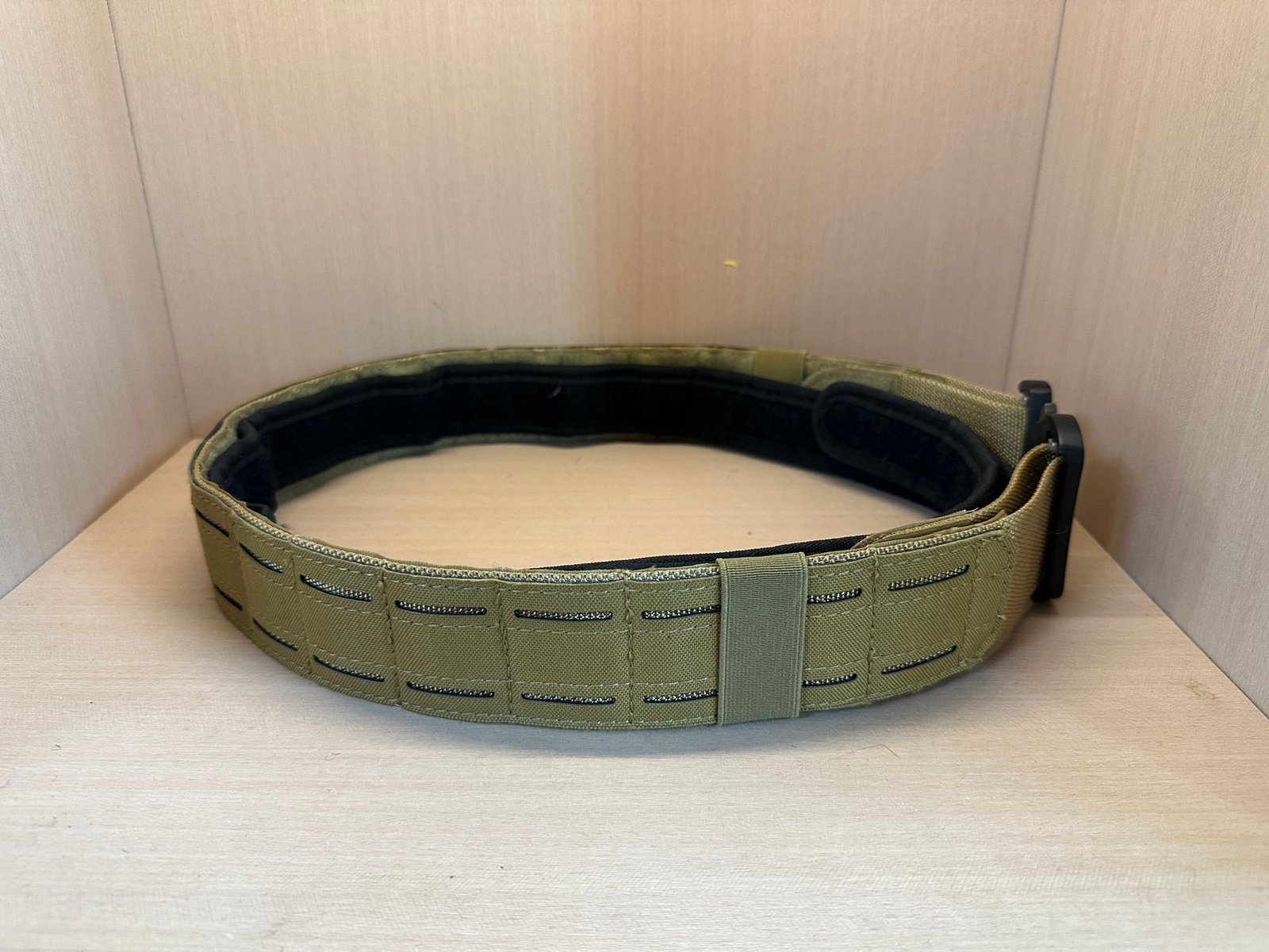 Laser-cut tactical belt reference with reinforced webbing and adjustable structure