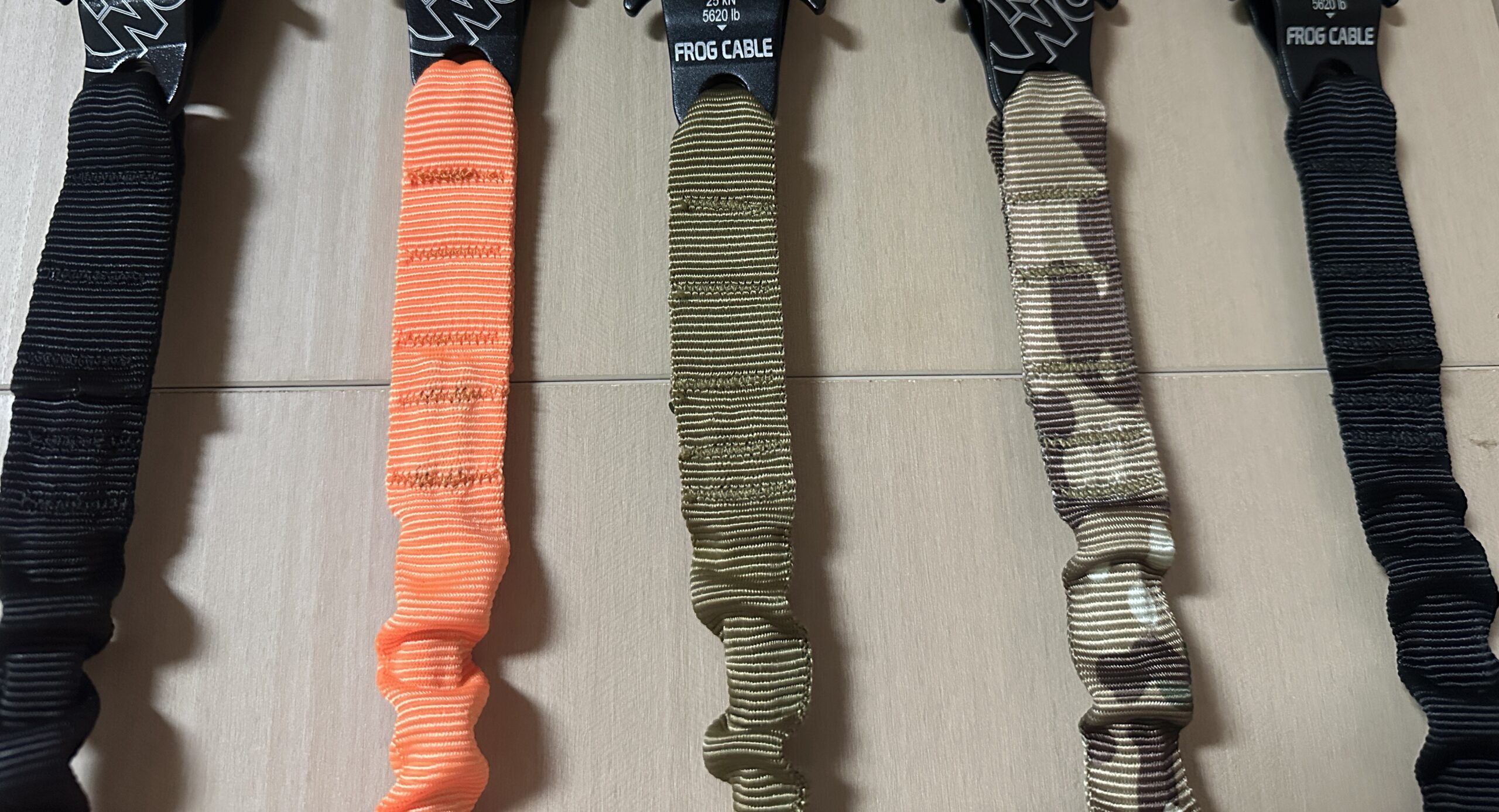 Bar-tack stitching on folded webbing below the clips of dog leash samples